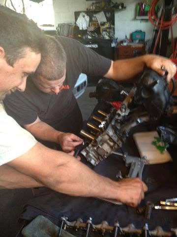 Kirk working on a performance engine assembly
