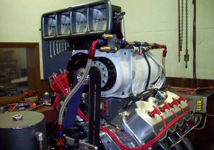 Large polished supercharger assembly in the workshop
